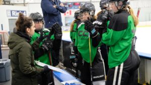 Hockey coach giving players a pep talk